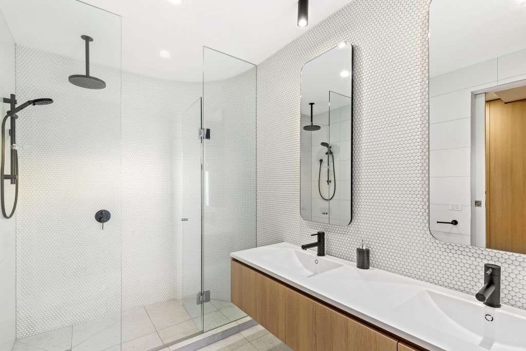 white marble bathroom that was recently renovated