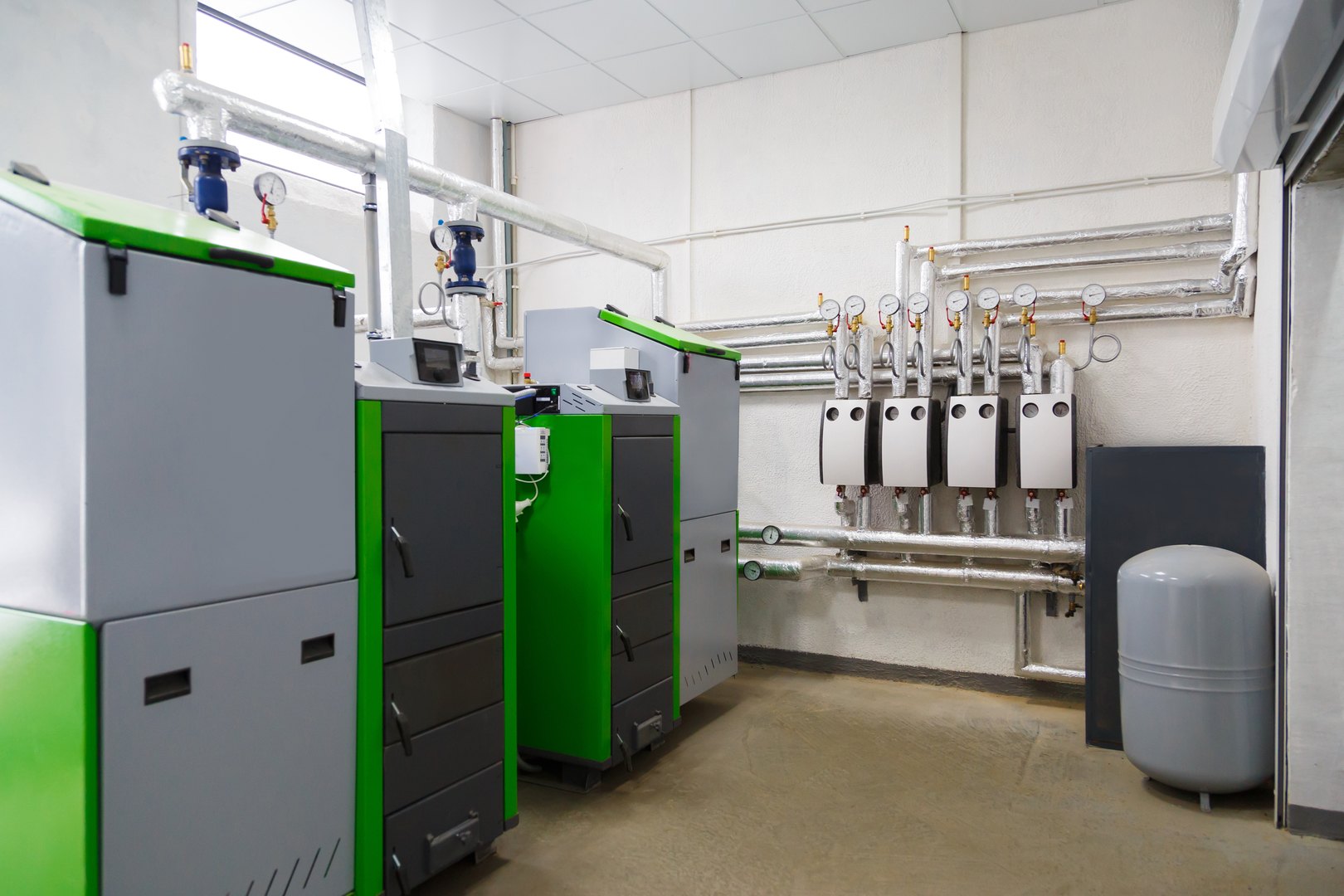 Large industrial boiler room with appliance using pallets as a fuel